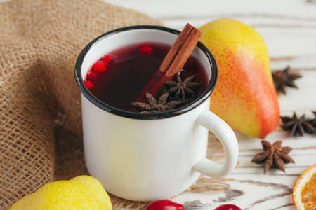 Autumn composition with hot mulled wine and spices on wooden backgroundの写真素材