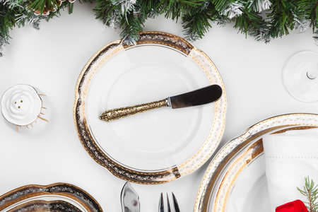 Close up beautiful Christmas table setting with decorationsの写真素材