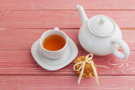 Homemade crunchy cookies and tea on a wooden tableの写真素材