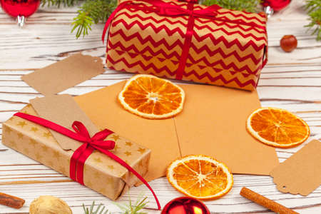 Christmas gift with spruce branches on wooden backgroundの写真素材