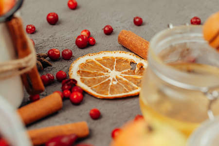 Berries and spices for mulled wine cooking close up on kitchen tableの写真素材