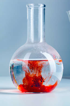 Laboratory flask glassware with reflections on table close upの写真素材