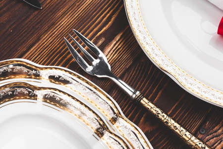 Brown wooden table with beautiful Christmas table settingの写真素材