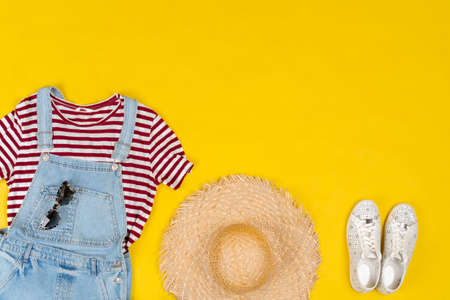 Set of female clothes and accessories on bright yellow backgroundの写真素材