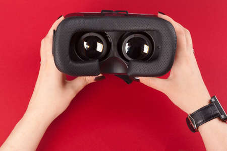 virtual vr glasses headset in handsの写真素材