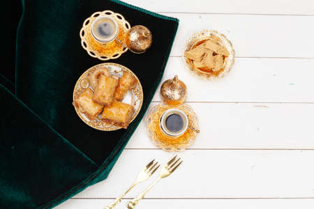 Cup of hot tea and a plate of turkish dessertsの写真素材