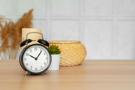 Close up of vintage alarm clock on wooden tableの写真素材