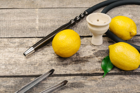 Parts of hookah and fruits on wooden background