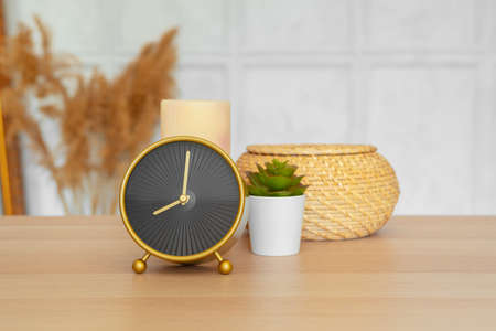 Close up of vintage alarm clock on wooden tableの写真素材