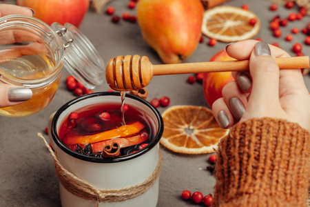 Christmas composition with hot mulled wine in rustic cupの写真素材