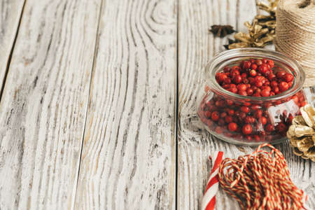 Glass bowl with cranberries on table close upの写真素材
