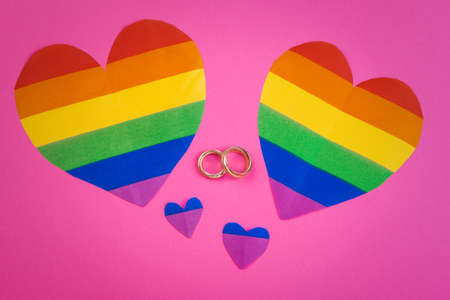 Gay Marriage Concept with Rainbow flag and ringsの写真素材