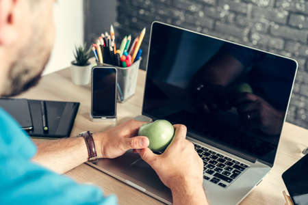Close up of a businessman at his working table in officeの写真素材