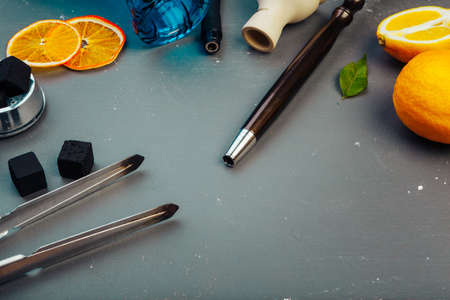 Parts of hookah and fruits on wooden backgroundの写真素材