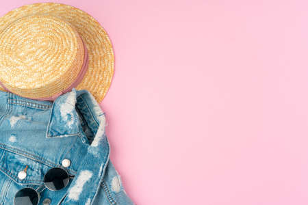 Stylish summer outfit for woman on pastel pink backgroundの写真素材