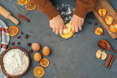 Womans hands preparing dough for cookies close upの写真素材