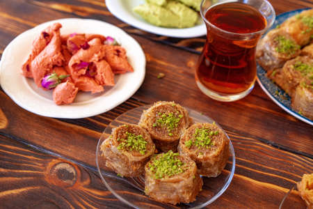 Turkish sweet baklava with Turkish tea on wooden background