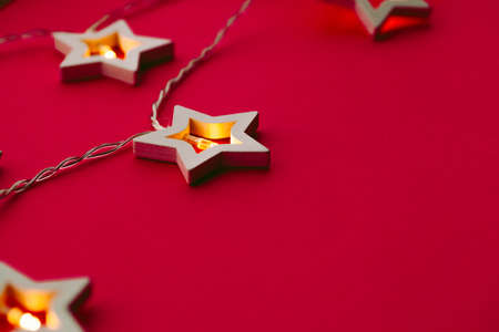 Illuminated star shaped garland on color background close upの写真素材