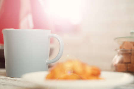 Cup of tea or coffee on modern kitchen backgroundの写真素材