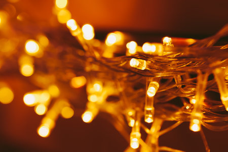 Bokeh light of holiday garland close upの写真素材