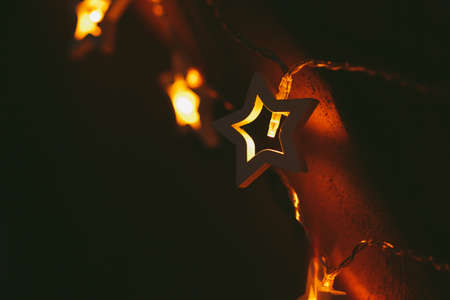 Beautiful bokeh light of star shaped garland in the darkの写真素材
