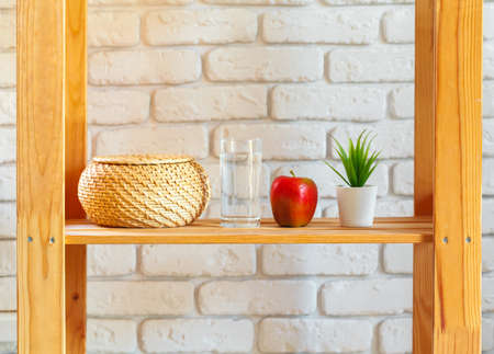 Wooden rack shelf with home decor stuffの写真素材