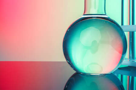 Laboratory chemistry glassware on green toned backgroundの写真素材