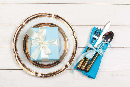 Top view of a beautiful table setting on white wooden backgroundの写真素材