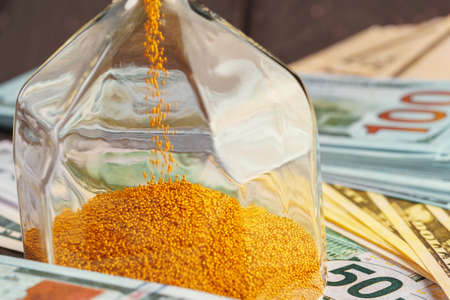 Time and money business concept. Sandglass and moneyの写真素材