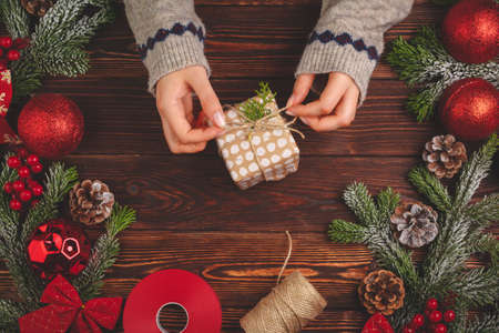 Christmas time. Process of packing gifts for holidaysの写真素材