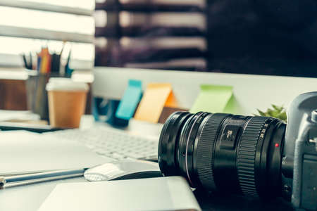 Working table of a photographer close upの写真素材