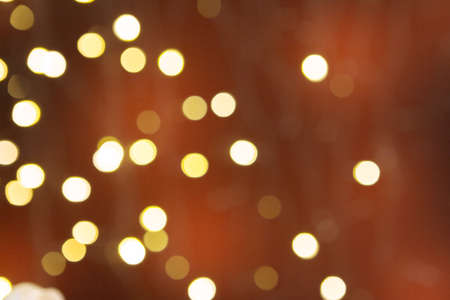 Brown blurred abstract sparkling festive bokeh backgroundの写真素材