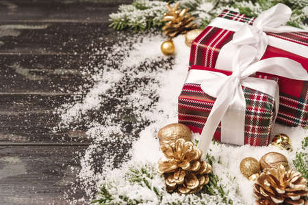 Winter holidays background with wrapped gift and copy spaceの写真素材