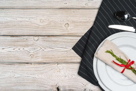 Elegant table setting with festive decor on wooden background