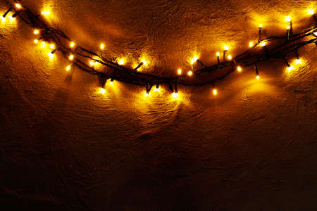 Abstract Christmas lights garland on dark backgroundの写真素材