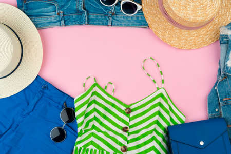 Set of summer clothes for woman on pink backgroundの写真素材