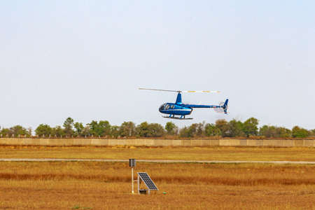 Helicopter flying in the sky during a sunny day