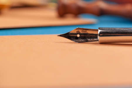 Craft paper letter with fountain pen close upの写真素材