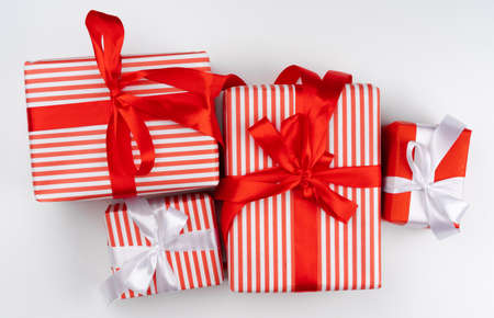 Top view of pile of christmas gifts on white background