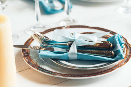 Close up shot of table setting for fine dining with cutlery and glasswareの写真素材