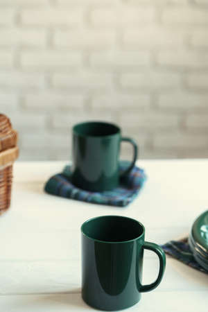 Green plastic kitchenware on a table close upの写真素材