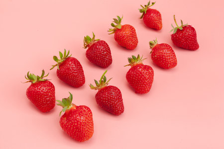 Strawberries on pink background. Fresh organic food conceptの写真素材