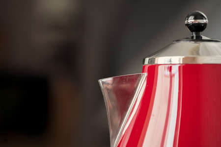Vintage style red electrical teapot in kitchen interiorの写真素材