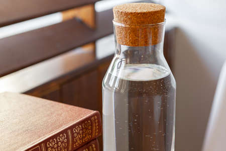 Close up of a glass bottleneck with liquid