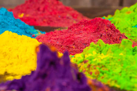 A bunch of colours placed on wooden background close upの写真素材