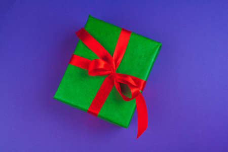 Gift box on purple background top viewの写真素材