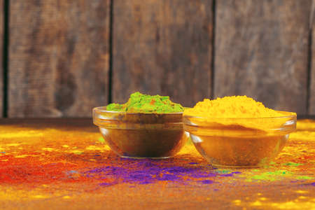 Bows of colorful Holi power close up on floorの写真素材