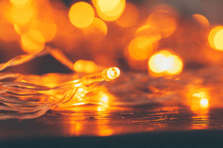 Illuminated garland close up on dark backgroundの写真素材