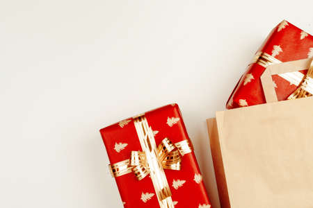 Top view, flat lay of red Christmas gifts on white backgroundの写真素材