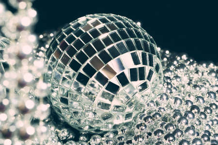 Mirror balls reflecting lights close up, nightlife backgroundの写真素材